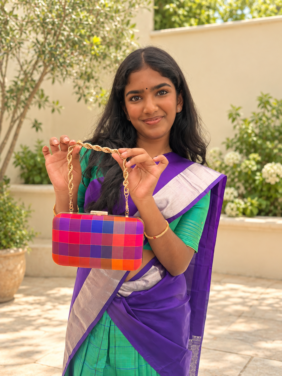 Label Madras multicolour checks clutch styled with a purple saree